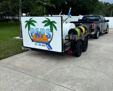 The Paps Exterior Cleaning trailer with the PAPS logo sign, parked with the work truck